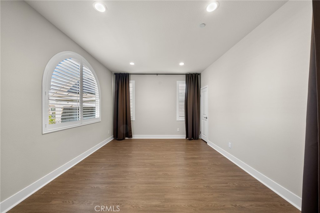 25110 Cherry Ridge Drive Canyon Country, CA 91387 - Photo 9 of 74 an empty room with windows