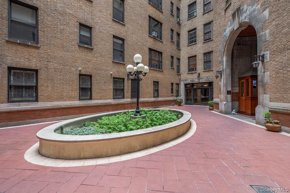 a view of a house with a garden and entertaining space