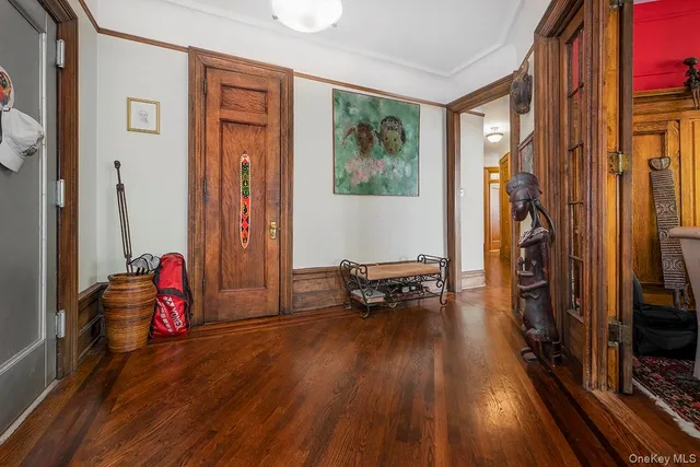 a view of a livingroom with furniture and gym equipment
