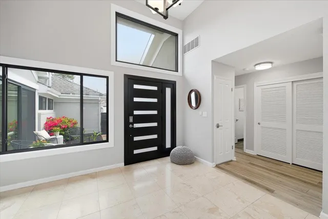 a view of livingroom with window and hallway