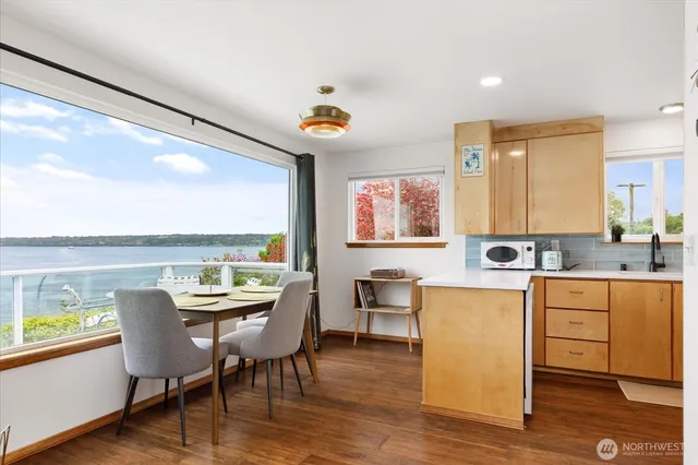 a view of a dining room with furniture window and wooden floor