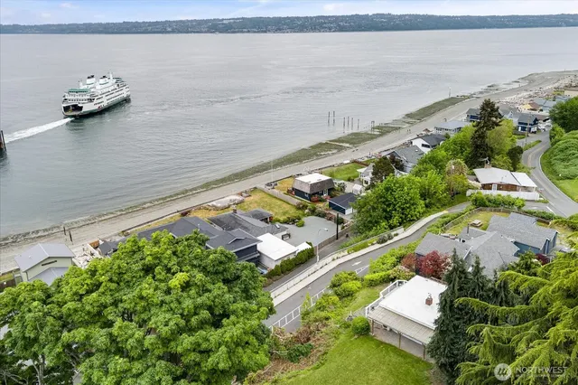 a view of lake with lawn chairs