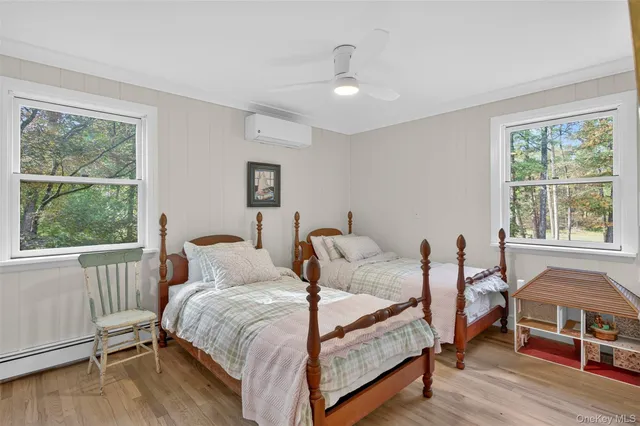 a bedroom with furniture and a window