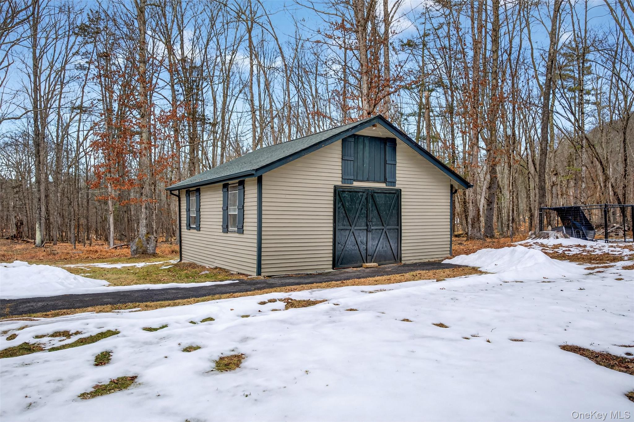 55 Ginger Road High Falls, NY 12440 - Photo 29 of 47 a backyard of a house with wooden fence and large trees
