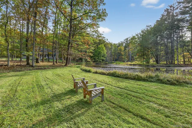 a view of lake with green space