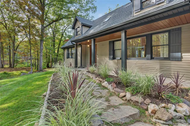 a front view of a house with garden