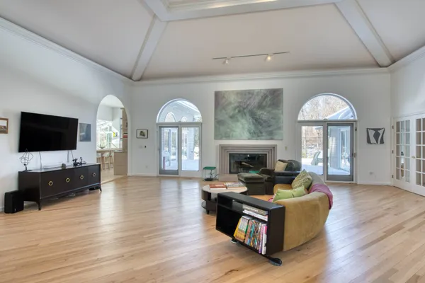 a living room with furniture fireplace and flat screen tv