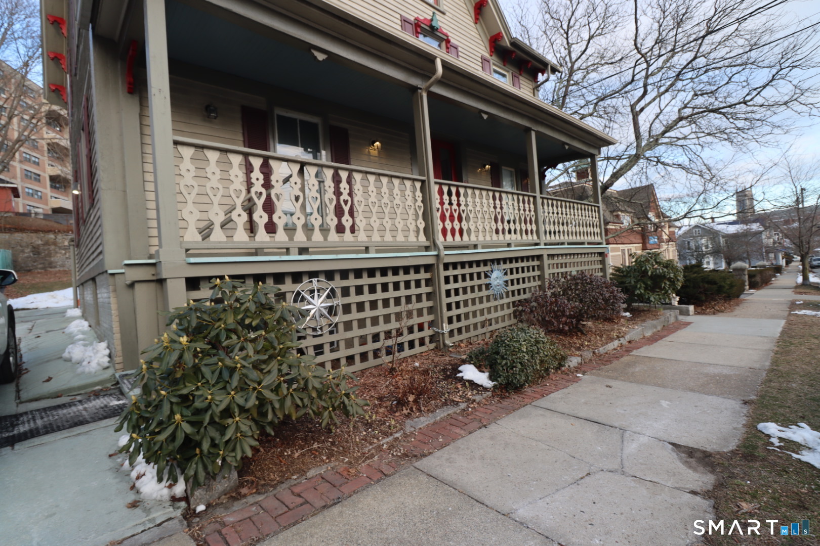 51 Franklin Street New London, CT 06320 - Photo 12 of 12 a view of a house with a small yard and wooden fence
