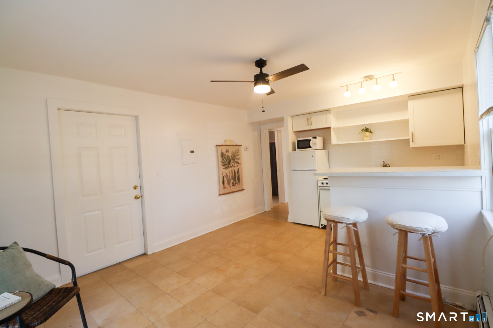 51 Franklin Street New London, CT 06320 - Photo 2 of 12 a view of a livingroom with furniture and a ceiling fan