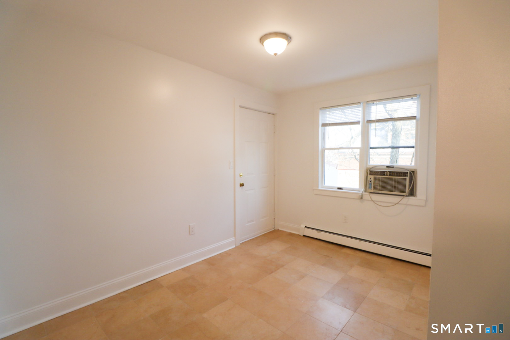51 Franklin Street New London, CT 06320 - Photo 5 of 12 an empty room with a window