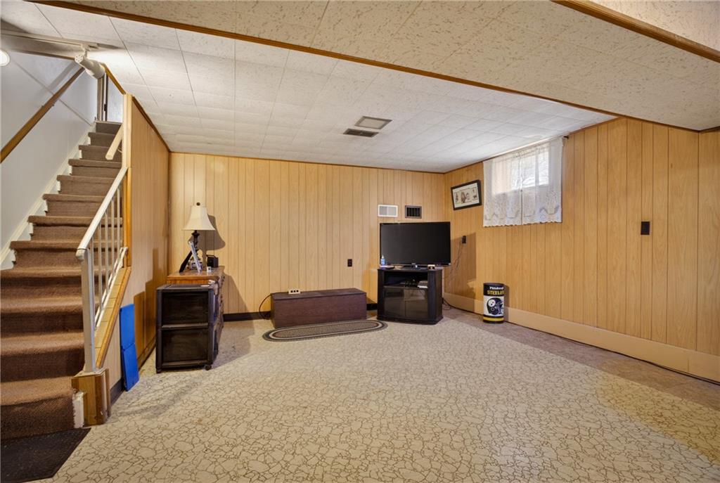 186 William Street McKees Rocks, PA 15136 - Photo 26 of 45 a view of a livingroom with furniture and a flat screen tv