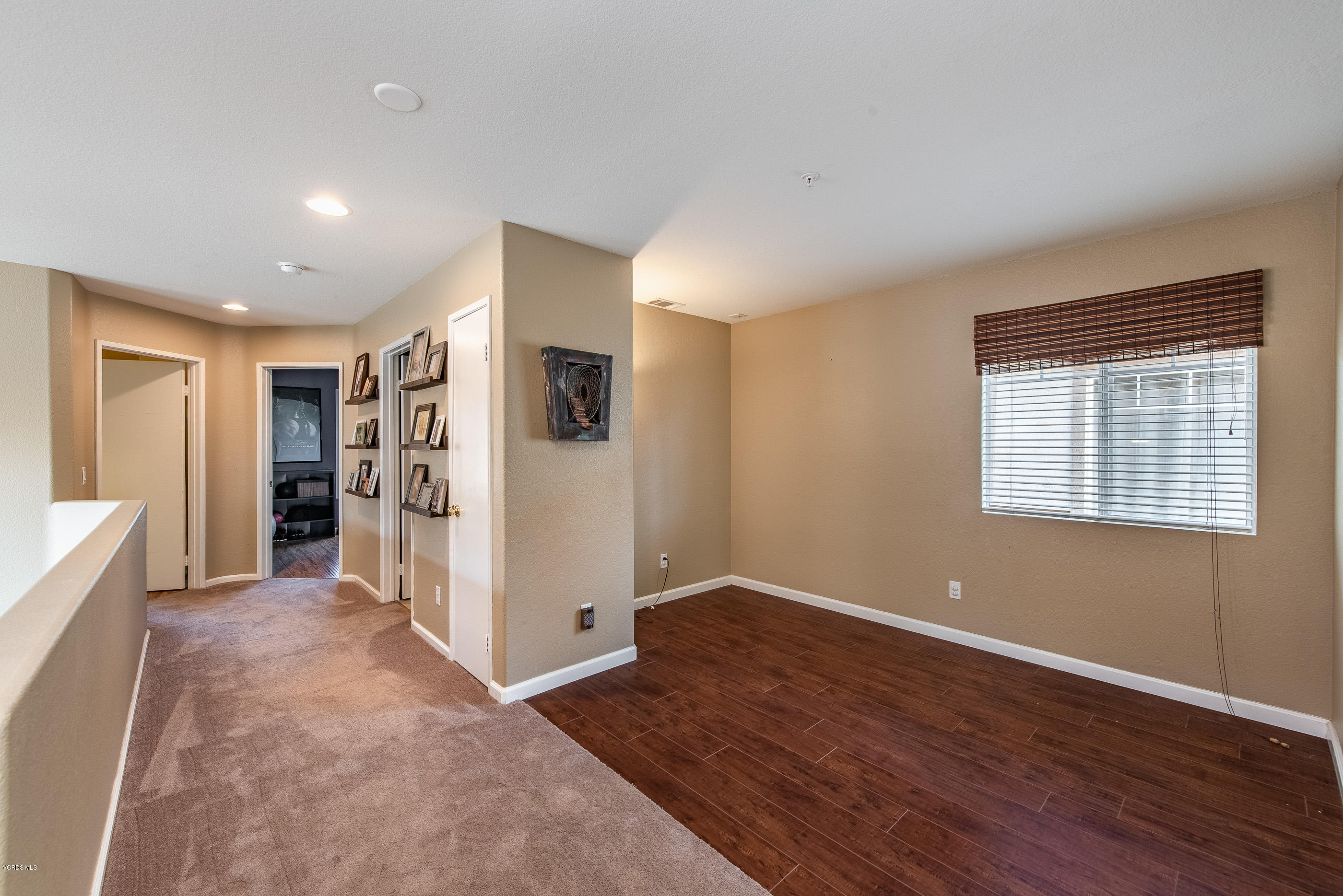 2050 Avila Place Oxnard, CA 93036 - Photo 17 of 31 a view of a livingroom with wooden floor and a refrigerator