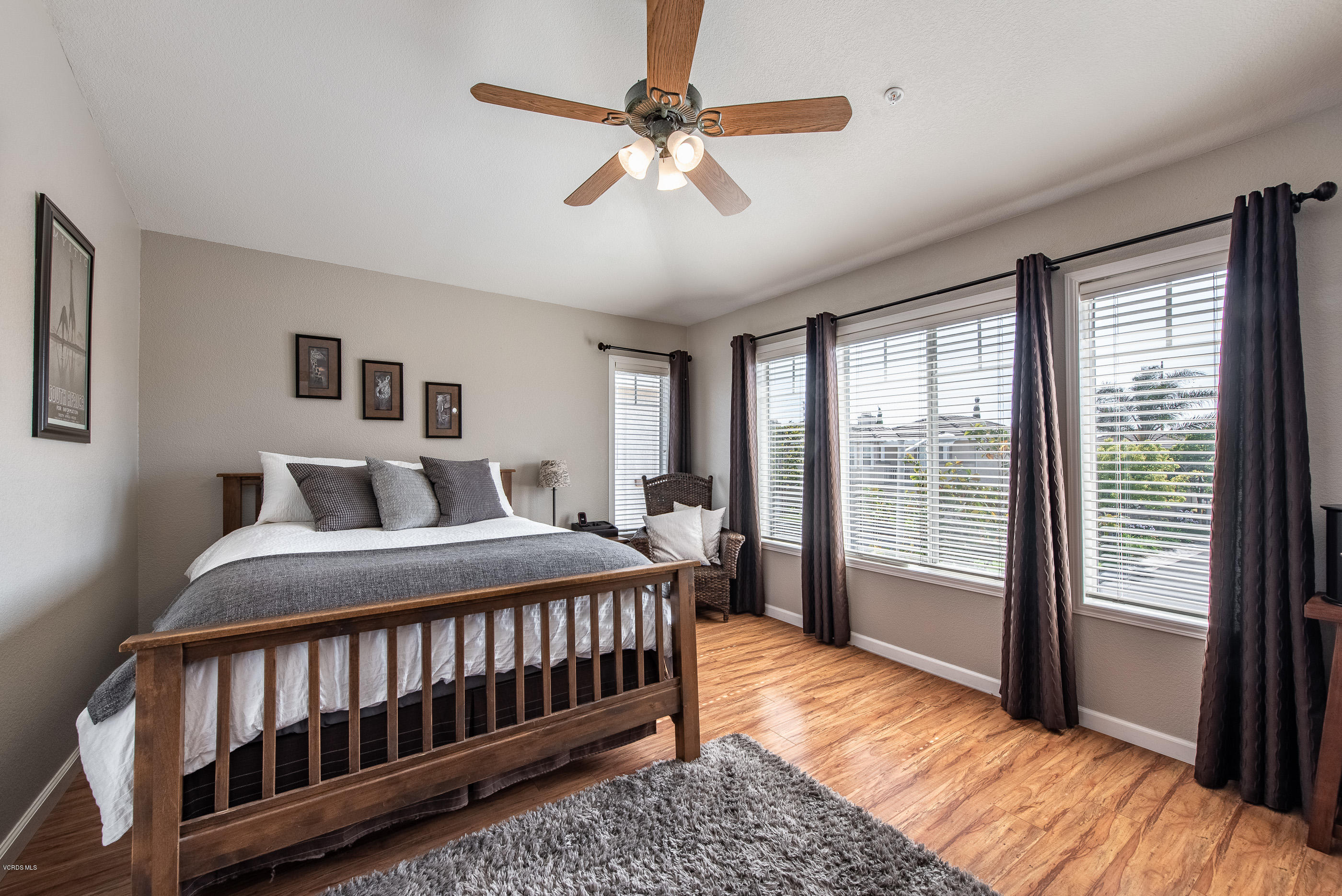 2050 Avila Place Oxnard, CA 93036 - Photo 18 of 31 a bedroom with a bed next to a large window