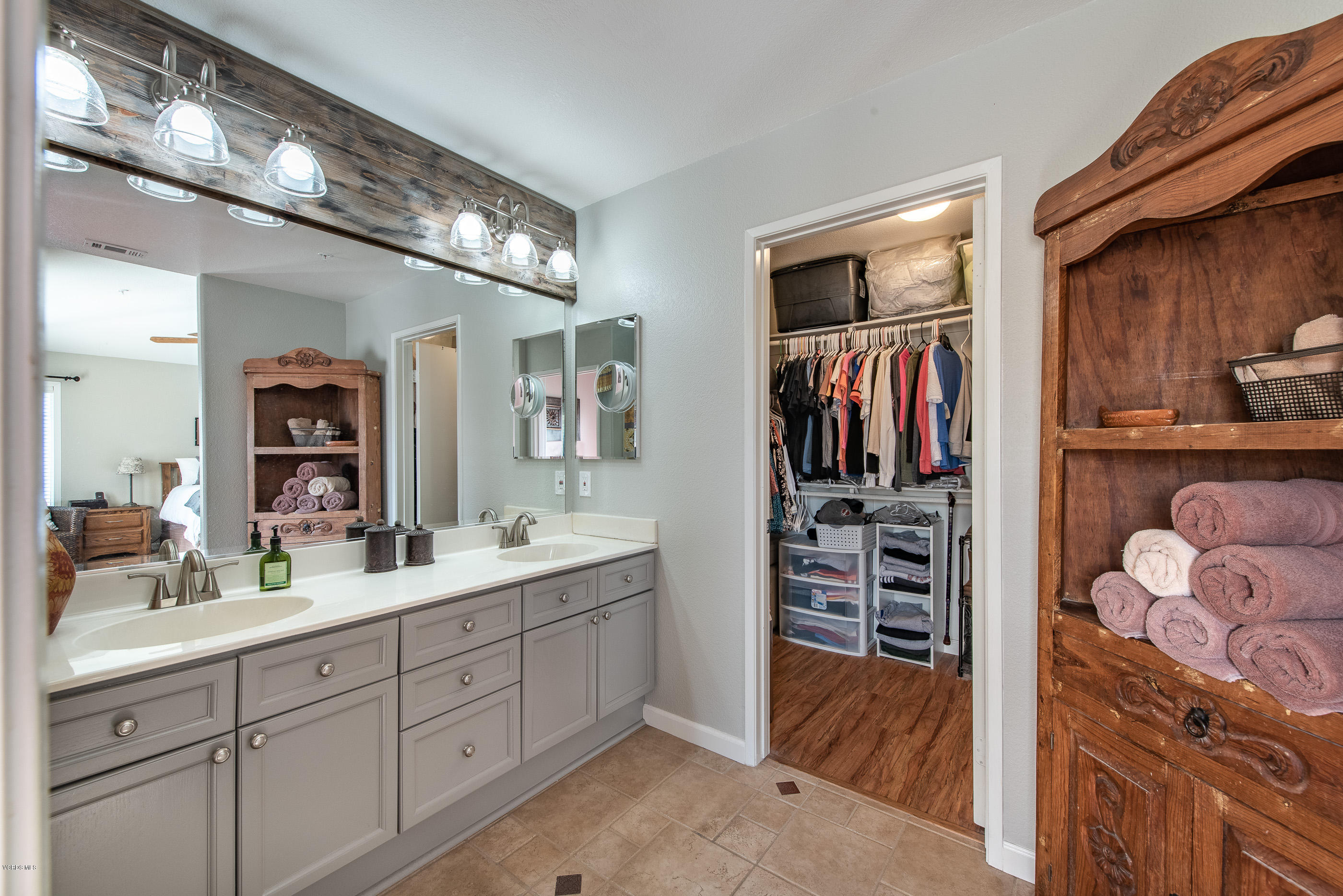 2050 Avila Place Oxnard, CA 93036 - Photo 20 of 31 a spacious bathroom with a sink a mirror and a shower
