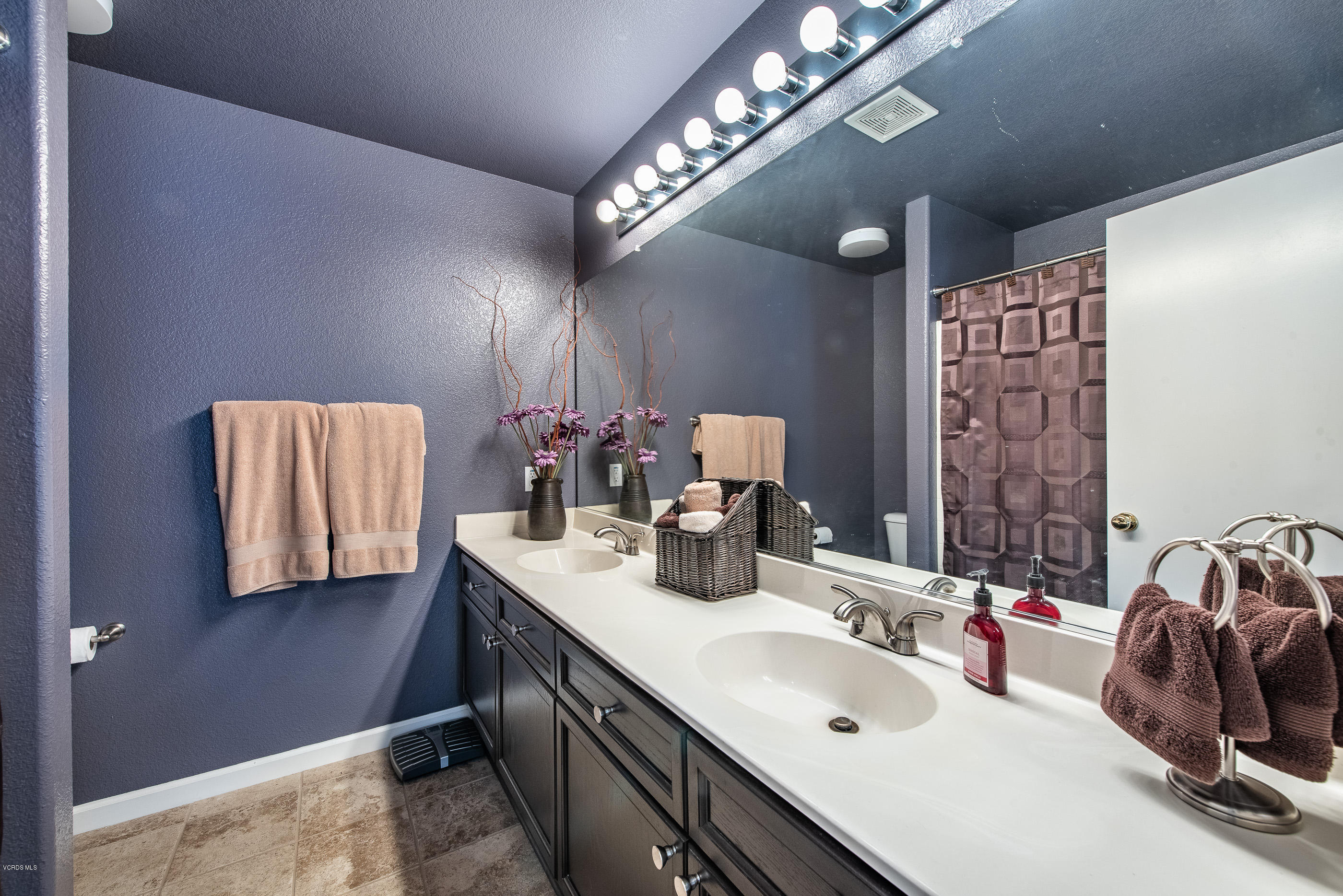 2050 Avila Place Oxnard, CA 93036 - Photo 24 of 31 a en suite bathroom with a double vanity sink and a mirror