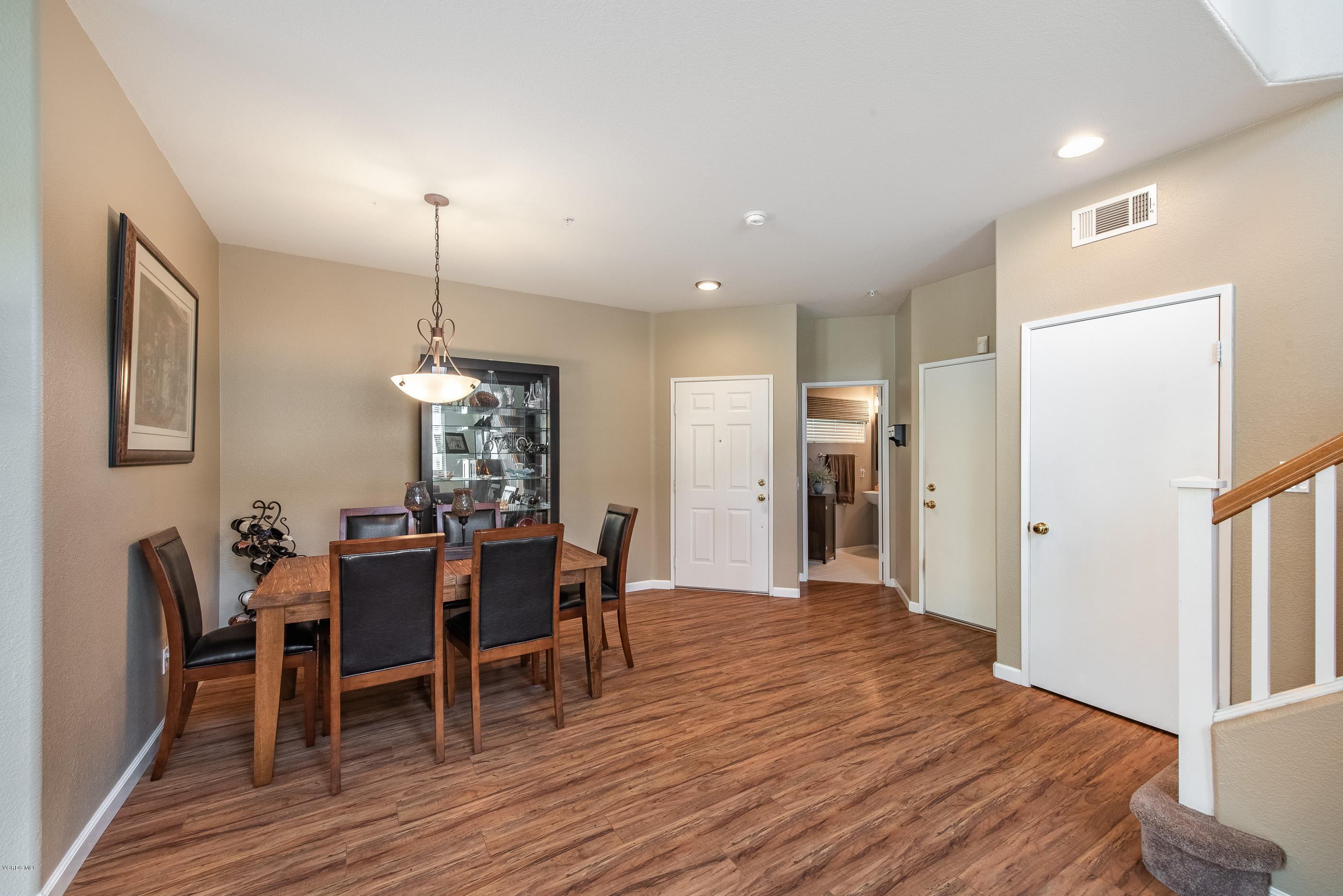2050 Avila Place Oxnard, CA 93036 - Photo 7 of 31 a view of a dining room with furniture and wooden floor