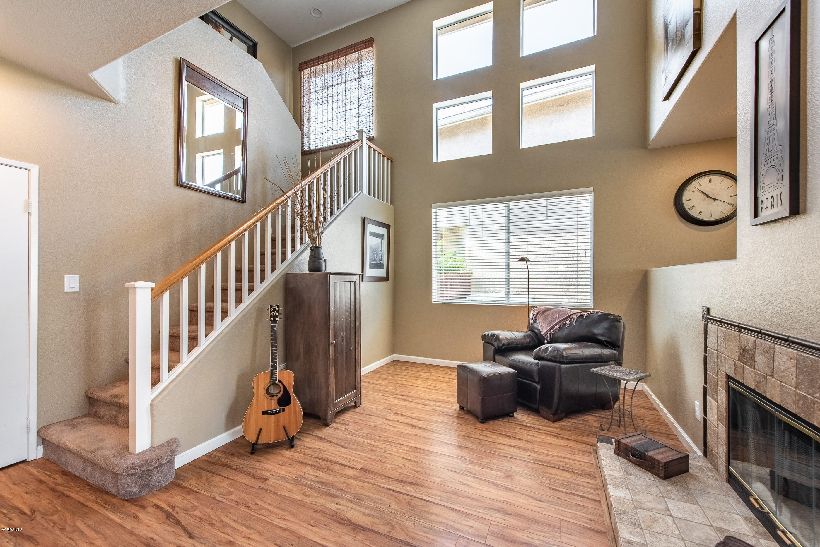 2050 Avila Place Oxnard, CA 93036 - Photo 8 of 31 a living room with furniture windows and a fireplace