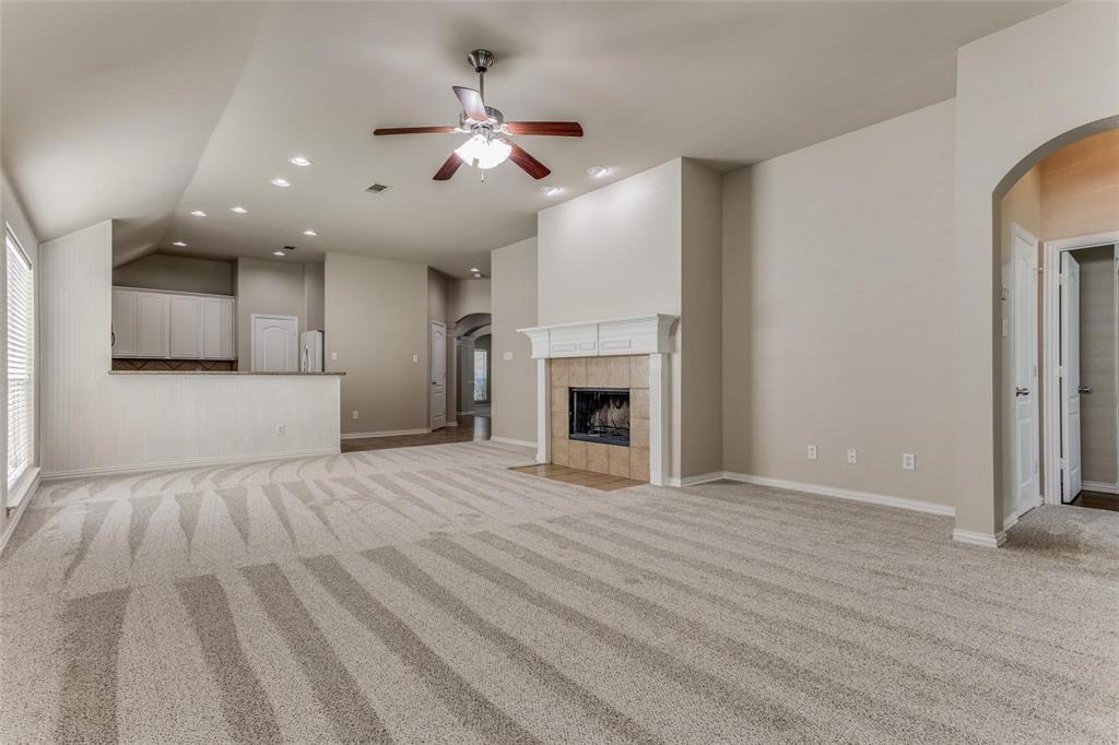 5304 Ridgepass Lane McKinney, TX 75071 - Photo 4 of 10 a view of an empty room with a fireplace