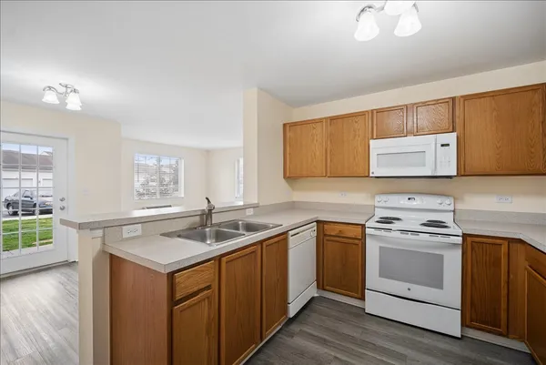 a kitchen with a sink stove and cabinets