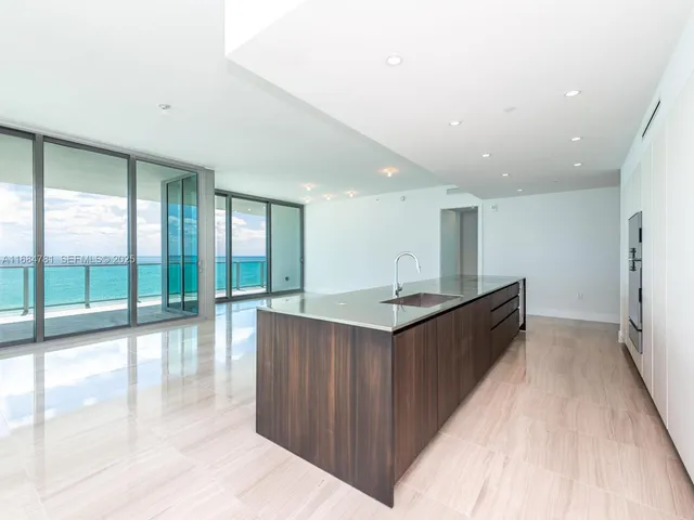 a view of house with backyard outdoor seating and lake