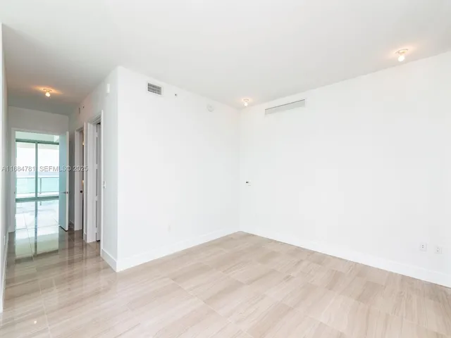 a view of a patio with couches and table and chairs