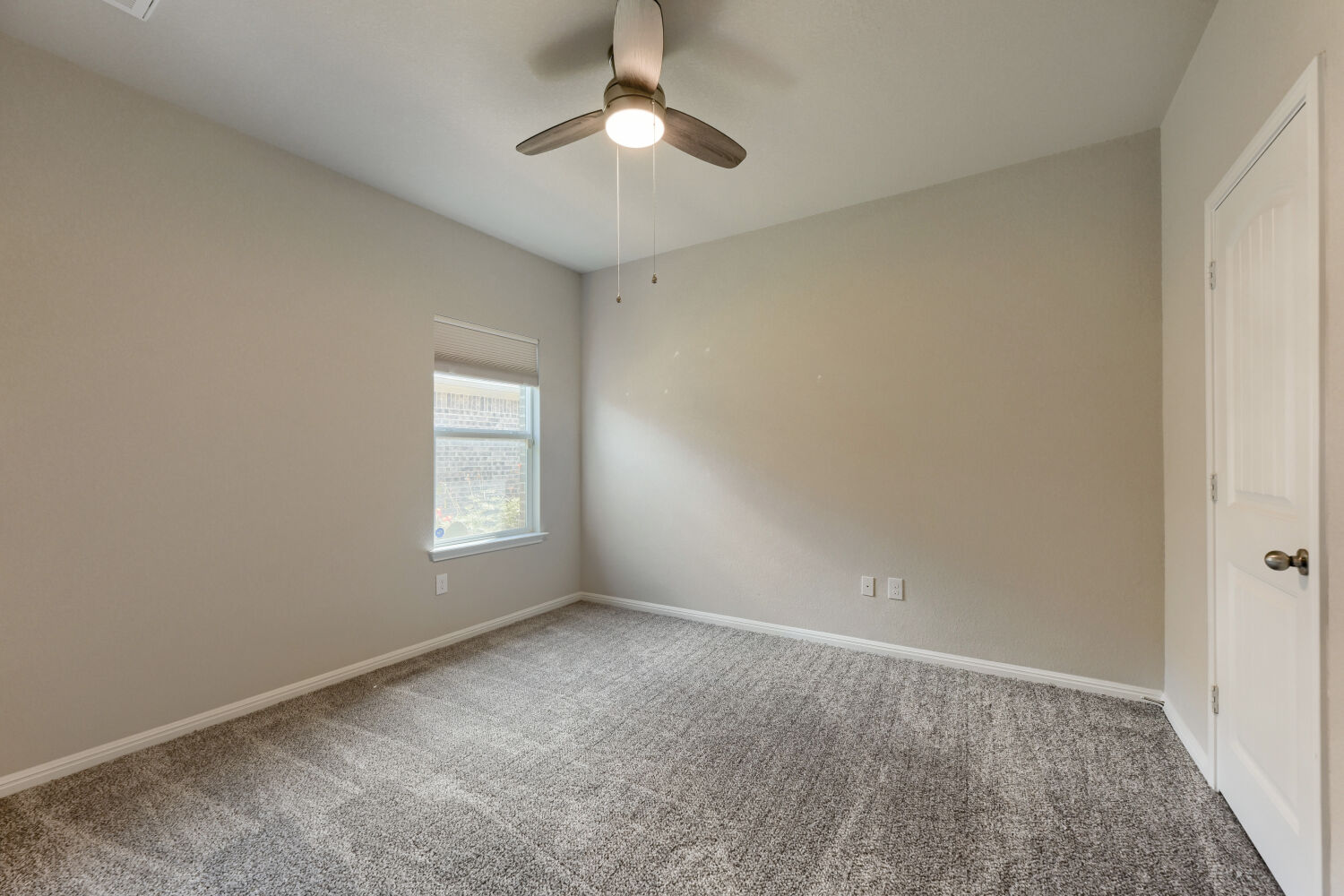 109 Moravia Road Georgetown, TX 78626 - Photo 19 of 25 Soft carpeting pairs with neutral walls and natural light from a side window.