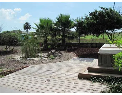 a view of a bench in the backyard