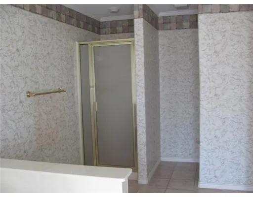 a bathroom with a shower and a sink