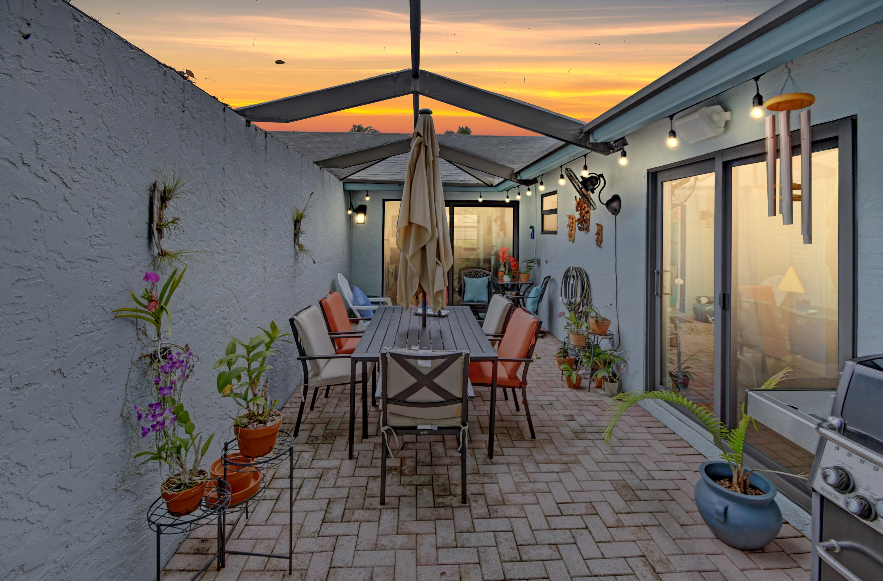 9103 Southwest 20th Street, Unit A Boca Raton, FL 33428 - Photo 37 of 52 Twilight Fun Patio