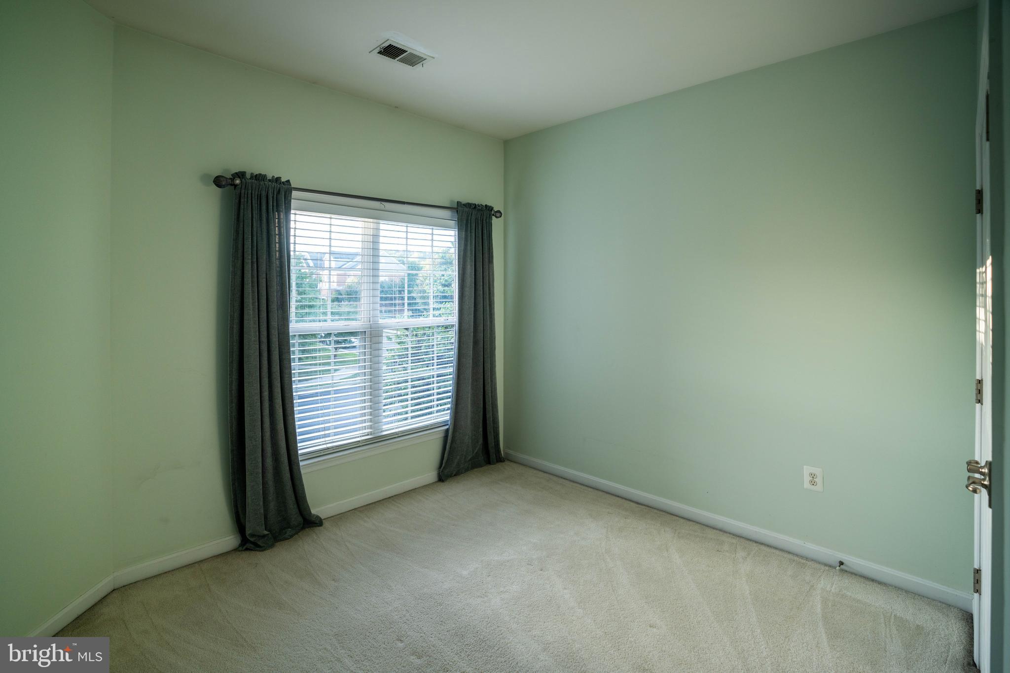 9571 Linnett Hill Drive Lorton, VA 22079 - Photo 11 of 27 an empty room with windows