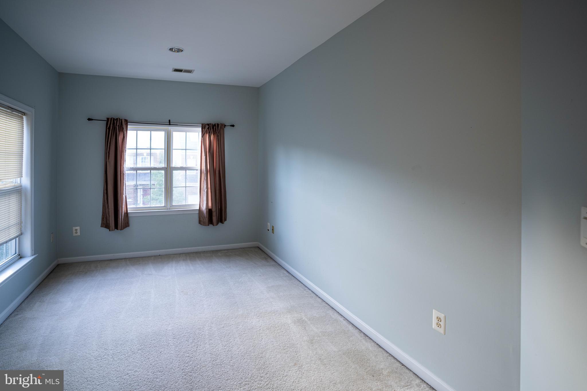 9571 Linnett Hill Drive Lorton, VA 22079 - Photo 16 of 27 an empty room with windows