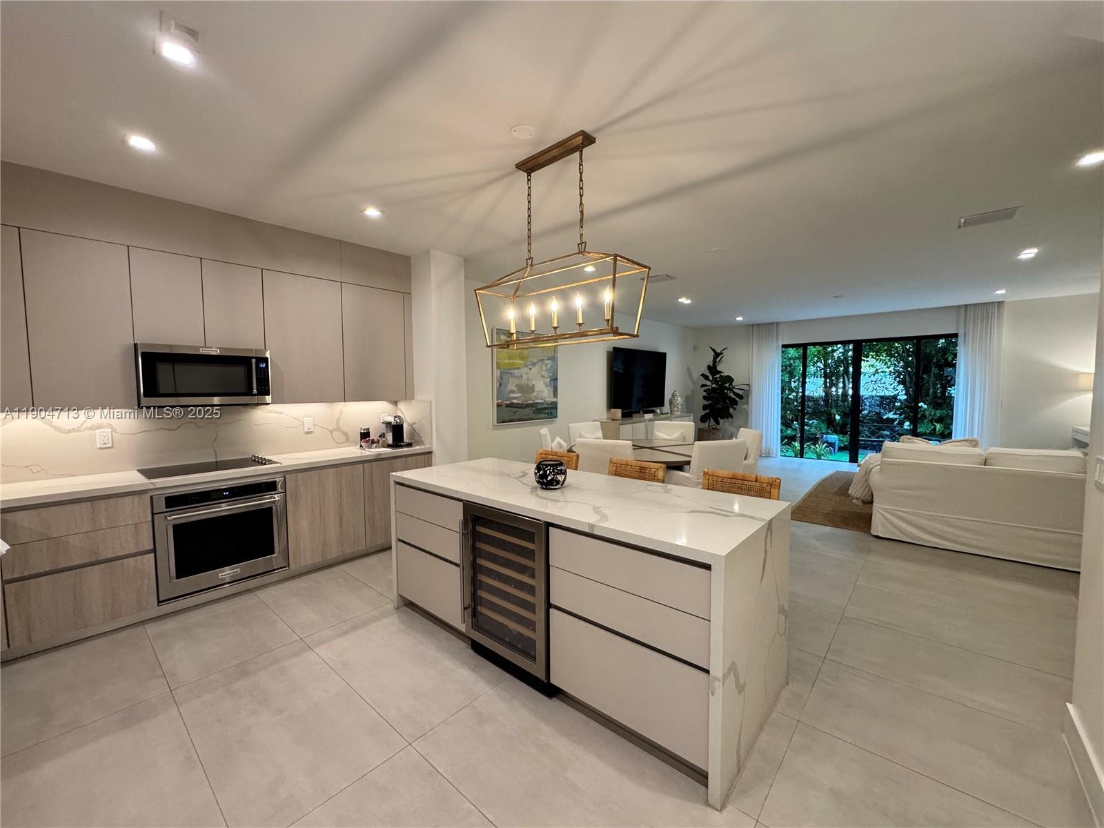 6824 Southwest 80th Street Miami, FL 33143 - Photo 1 of 29 a kitchen with a stove sink and a refrigerator