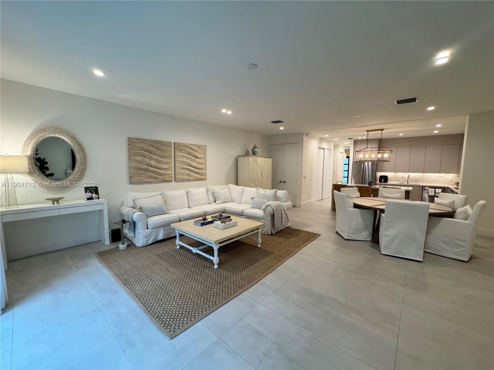 6824 Southwest 80th Street Miami, FL 33143 - Photo 11 of 29 a living room with furniture and a table