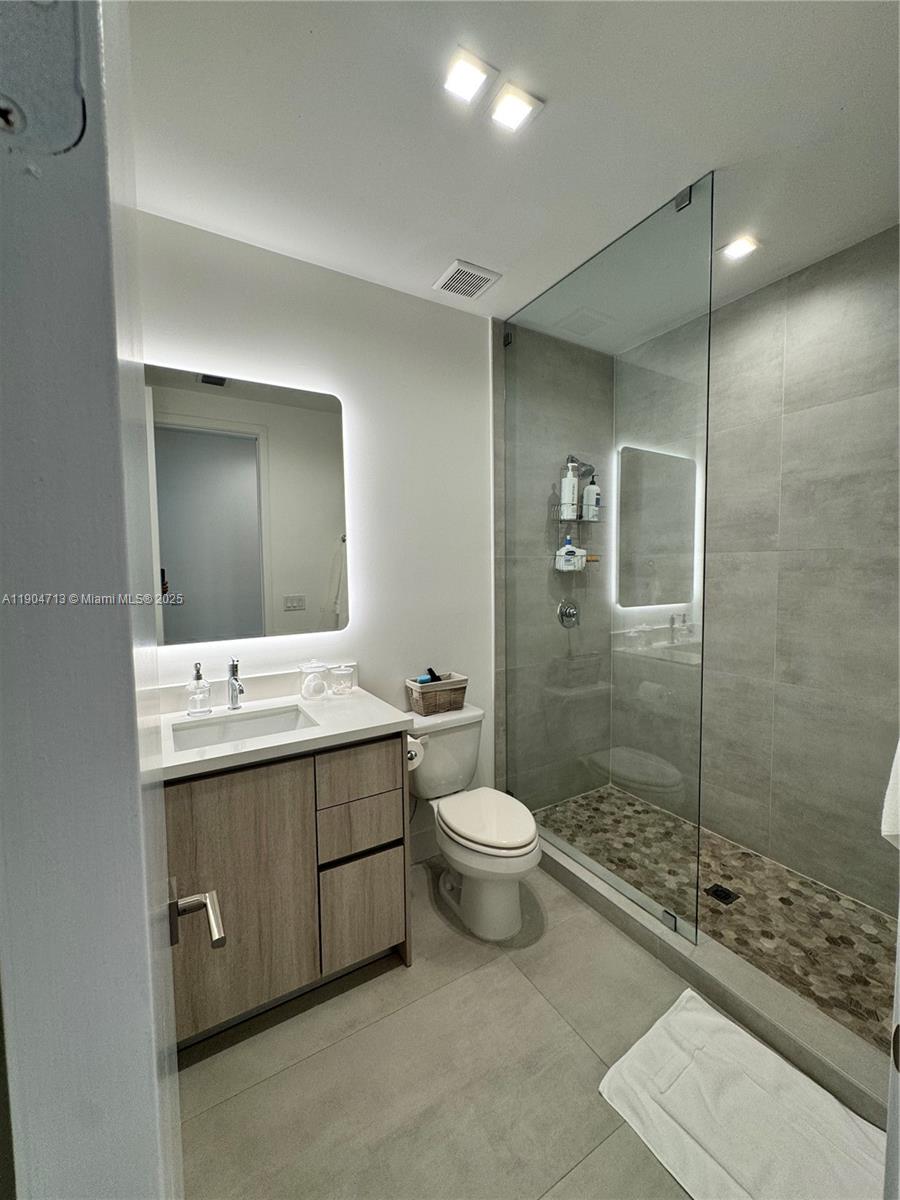 6824 Southwest 80th Street Miami, FL 33143 - Photo 18 of 29 a bathroom with a sink toilet and shower