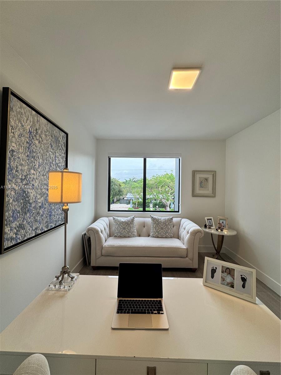 6824 Southwest 80th Street Miami, FL 33143 - Photo 25 of 29 a living room with furniture and a window