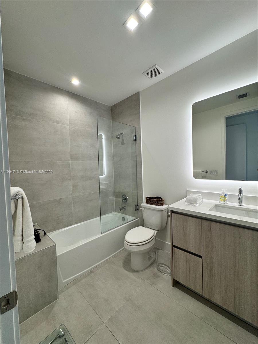 6824 Southwest 80th Street Miami, FL 33143 - Photo 26 of 29 a bathroom with a sink a toilet and shower