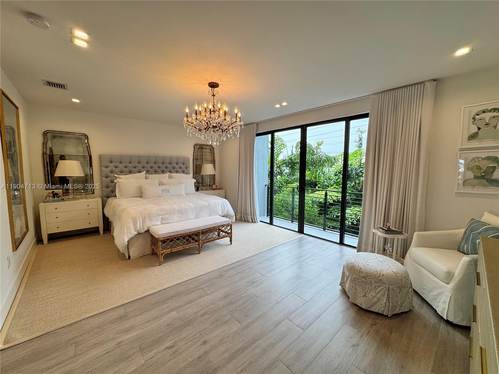 6824 Southwest 80th Street Miami, FL 33143 - Photo 27 of 29 a bedroom with a bed and large window