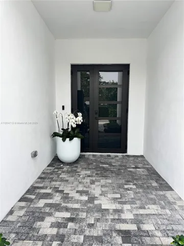 a bathroom with a toilet sink vanity and mirror