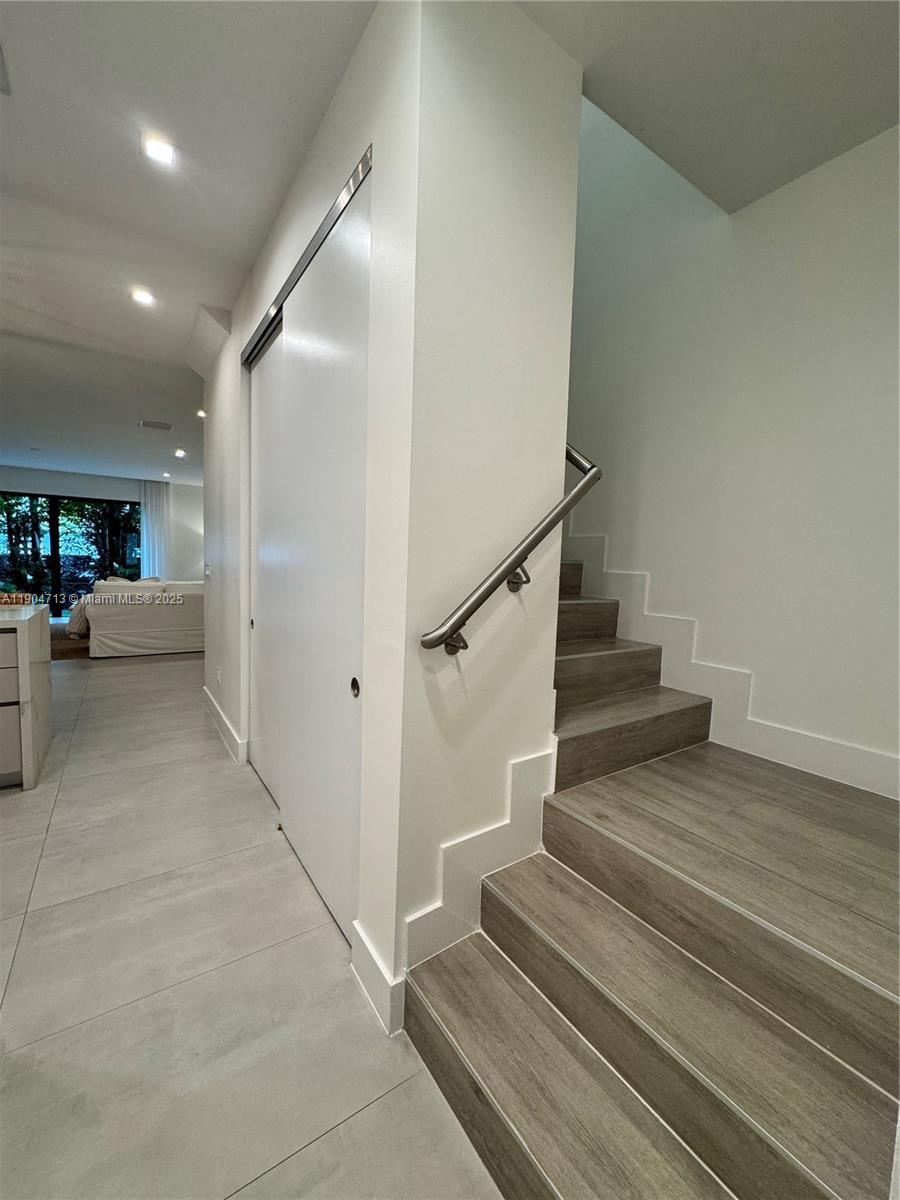 6824 Southwest 80th Street Miami, FL 33143 - Photo 7 of 29 a view of entryway and hall with wooden floor