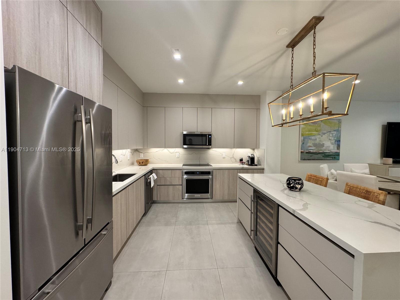 6824 Southwest 80th Street Miami, FL 33143 - Photo 8 of 29 a large kitchen with a large counter top appliances and cabinets