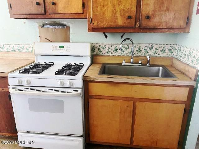 17 Clark Drive Howell, NJ 07731 - Photo 11 of 31 a kitchen with a stove and a sink