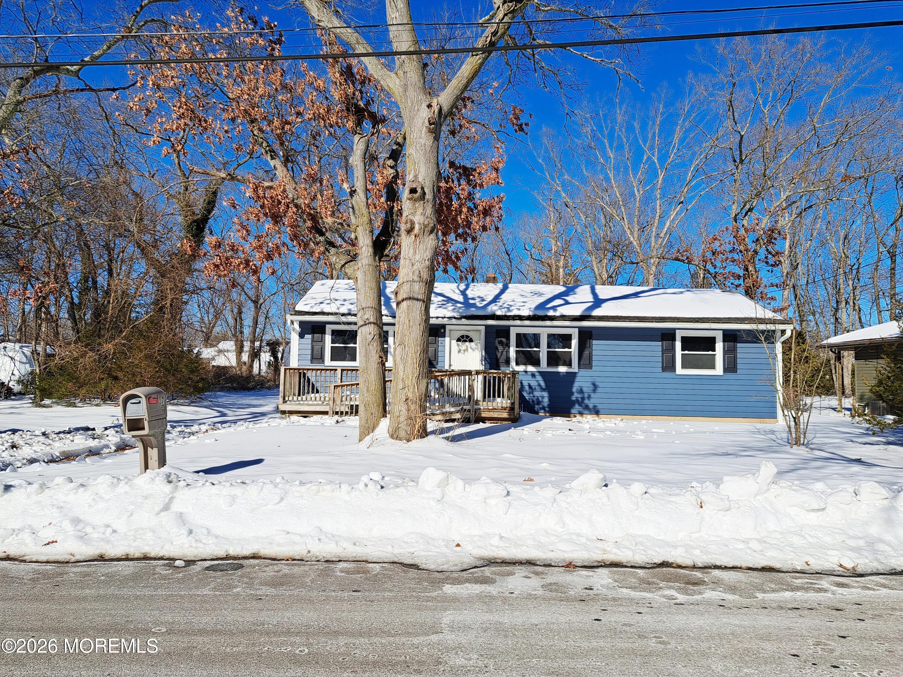 17 Clark Drive Howell, NJ 07731 - Photo 2 of 31 a front view of a house with a yard