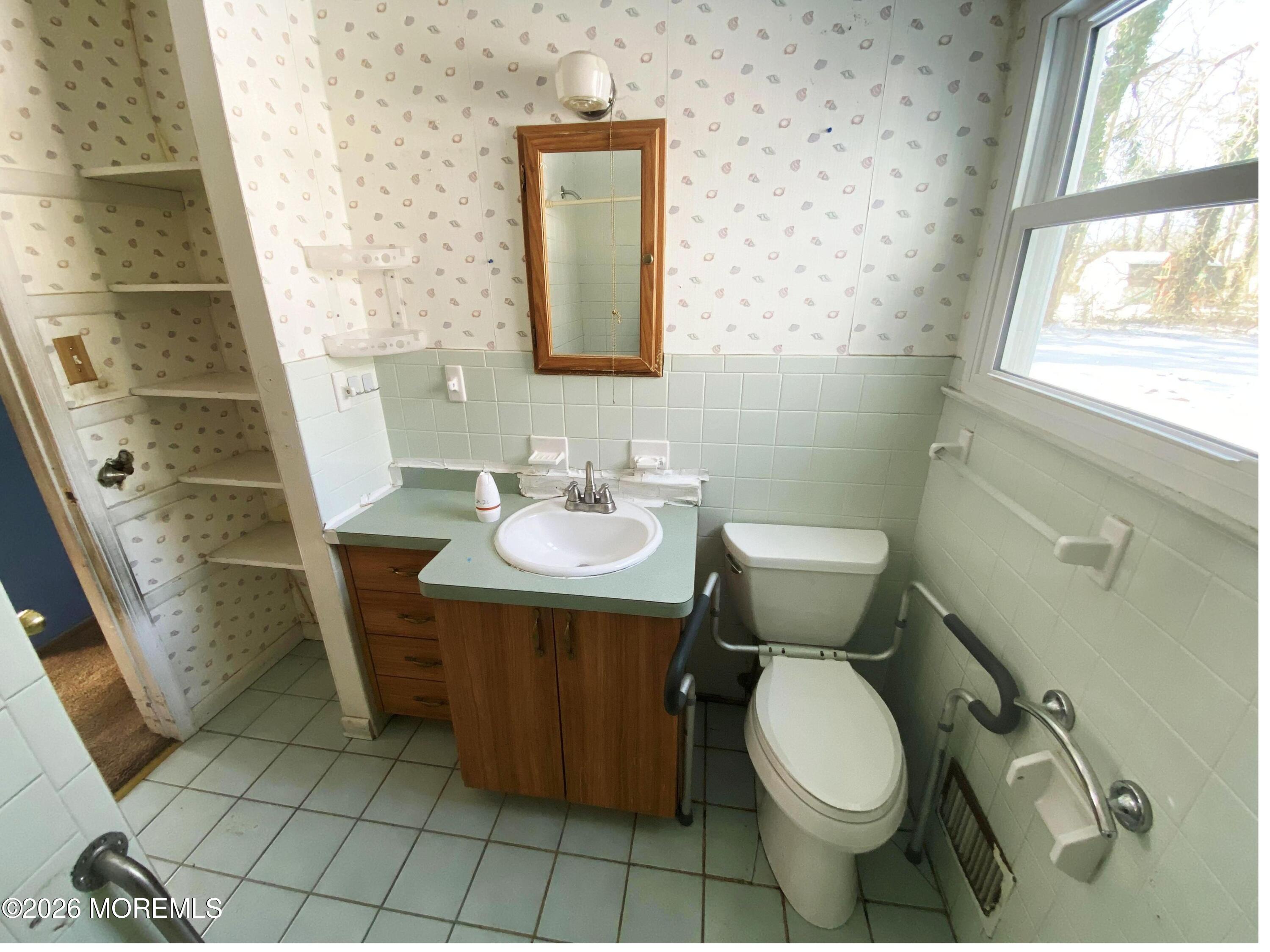 17 Clark Drive Howell, NJ 07731 - Photo 27 of 31 a bathroom with a toilet sink and mirror