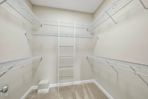 a bathroom with a sink a toilet a mirror a bathtub and shower