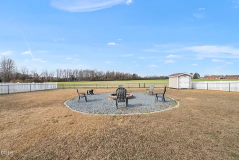 a view of a field with an ocean view