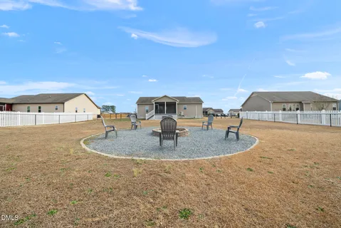 a roof deck with table and chairs