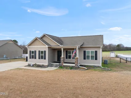 a front view of a house with yard