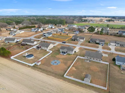 an aerial view of residential houses with outdoor space
