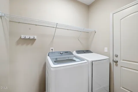 a kitchen with stainless steel appliances granite countertop a stove a sink dishwasher a refrigerator and a microwave oven with wooden floor