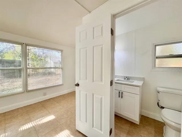 a bathroom with a toilet sink and tub